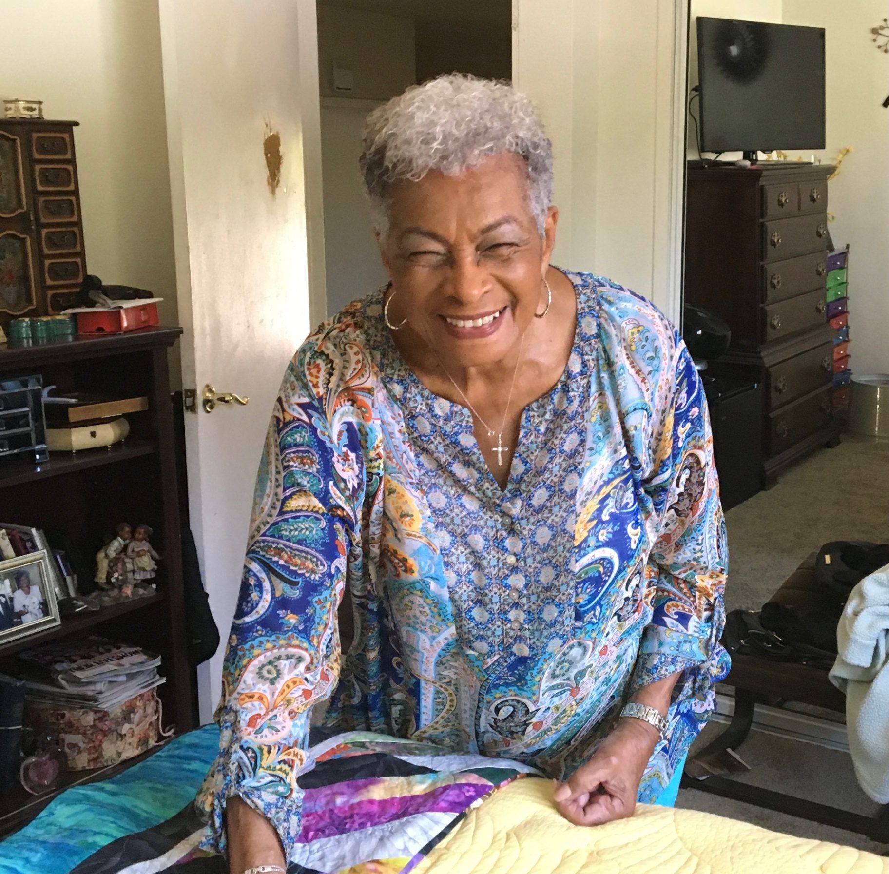 Portrait of our grandmother, the founder of Cousins Camp, laughing at home